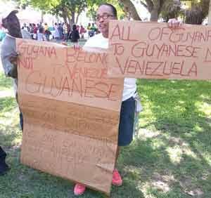  Guyanese Denise DeFreitas displaying her placards for President Maduro and his entourage