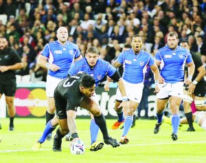 Malakai Fekitoa (centre) evaded the attention of four Namibia players to score his try for New Zealand in the match at the Olympic Stadium.