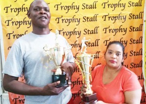 Petal Hassan of Trophy Stall presents one of the trophies on offer to Terrence Poole. All trophies & medals are sponsored by GABA & Trophy Stall.