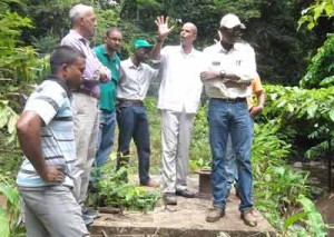 Ministers of Communities and Public Infrastructure, Ronald Bulkan and David Patterson respectively, engineers and Regional Officials in discussions at the Salbora Creek 