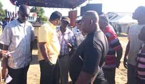 Minister of Public Security, Khemraj Ramjattan (center) chats with residents