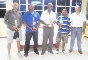 From left: Pur Persaud, Max Persaud, winnersBrian Hackett, Imran Khan and LGC President Oncar Ramroop after the presentation.