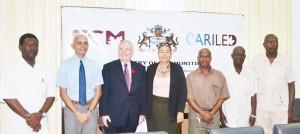 Minister of Communities, Ronald Bulkan and Canadian High Commissioner, Pierre Giroux, with Heads of the various Municipalities yesterday.