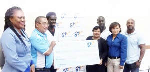 GTT’s Anjanie Hackett (fourth from right) hands over the sponsorship cheque to GRFU President Peter Green in the presence of members of the GRFU’s executive as well as GT&T PRO Nadia DeAbreu.