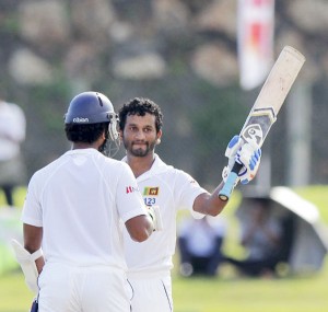 Dimuth Karunaratne raises the bat after making hundred, Sri Lanka v West Indies, 1st Test, Galle, 1st day, October 14, 2015 ©Associated Press