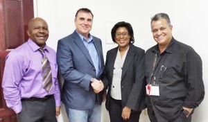 Tourism Minister Catherine Hughes (2nd right) greets Dynamics Airways’ Chief Operations Officer, Mr. John Mullins. Also in photo are Captain Gerry Gouveia (right) and the Director General of the Ministry of Tourism, Mr. Donald Sinclair 