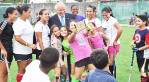 FIH President Leandro Negre poses with a group of young players  and members of the national Ladies team during his visit in may this year. 