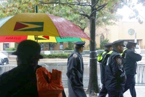 Some mourners bore umbrellas of red, yellow and green in remembrance of Officer Holder, who emigrated from Guyana.