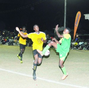 GDF’s Delroy Fraser (right) and Buxton’s Rondell Assanah battles for possession. 