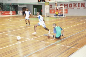 Part of the action on opening night of the Inter-Ministry Banks Beer-sponsored Futsal Competition which is currently being played, at the Cliff Anderson Sports Hall. 
