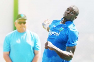 Jason Holder bowls under the bright sun at a practice session, Galle, October 13, 2015©AFP