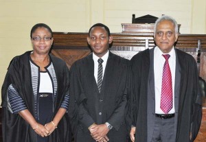 New addition to the Guyana Bar Kadeem Davis (centre) flanked by Attorney-at-Law Christopher Ram and Justice Roxanne George on Friday.