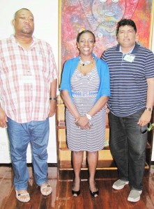 Minister Nicolette Henry is flanked by BCB President Anil Beharry (right) and RHTY&SC’s Hilbert Foster. 