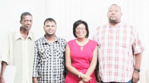 Officials of the RHTY&SC led by Secretary/CEO Hilbert Foster (right) and Minister Henry (2nd right). 