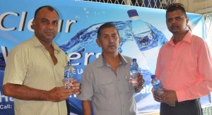 Narendra Lucknauth (right) of Clear Water, Ramchand Ragbeer (center) President of GFSCA and Ricky Deonarain at the sealing of the sponsorship deal.