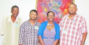 Officials of the RHTY&SC led by Secretary/CEO Hilbert Foster (right) and Minister Henry (2nd right). 