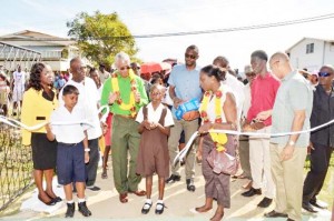 President David Granger, Director of Sports Christopher Jones and Minister Nicolette Henry participates in the ribbon cutting ceremony for the Fyrish Basketball court and pavilion.