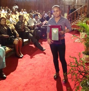 Trishel Torres displays her Desrey Fox Award.