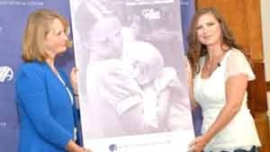 urse Susan Berger, left, and Amanda Scarpinati pose with a copy of a 1977 Albany Medical Center annual report during a news conference 