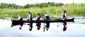 In some areas, children are required to travel by boat to school.