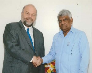 US Ambassador, Perry Holloway meeting with GECOM Commissioner, Dr. Steve Surujbally.