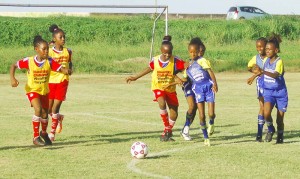 Action in last weekend’s competition in the Girls Pee Wee football tourney at the Ministry of Education ground, Carifesta Avenue.