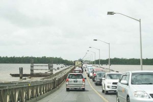 The current Demerara Harbour Bridge structure, with the mammoth traffic jam.