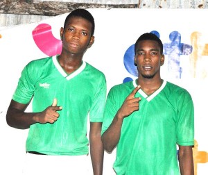 (from left)- Troy Lewis and Clarence Huggins pose for a photo op following their win against Winners Connection on Friday night at the Victoria Community Centre ground.