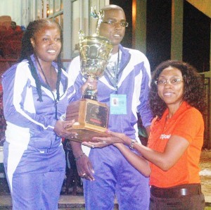Flashback! Digicel’s, Jacqueline James  presents the overall C/ship Trophy to North  Georgetown’s, Mariska Williams. 