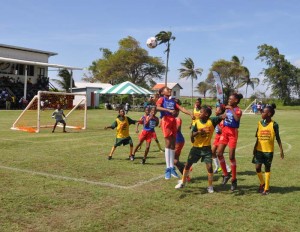  Part of the action in the final game of the day that featured South Ruimveldt (Blue and Red uniforms) and St. Agnes yesterday at the Ministry of Education ground, Carifesta Avenue.