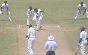 Steven Jacobs drives for four during his fourth First-Class half century at Providence yesterday.