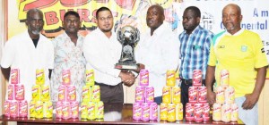 Continental Agencies Limited Marketing and Sales Manager Avalon Jagnandan (3rd left) hands over the lien trophy to EBFA President Franklin Wilson in the presence of EBFA executives from right, Noel Harry, Marlon Leitch, Seenauth Ramsahai and Clive Matthews. 