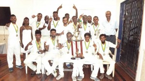Members of the victorious UG team with their accolades. GCA head Roger Harper is standing at extreme right. 