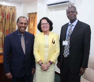 First Lady Sandra Granger is flanked by Dr. Edward Greene (left) and Dr. Martin Odiit.