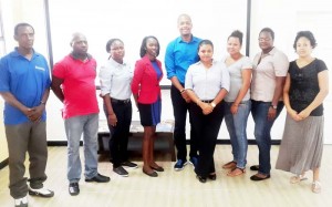 Newly-elected President of the National Association for Women’s Football (4th left) poses with NC Chairman Clinton Urling (centre), General Secretary, Ms. Deidre Davis (4th right) and members of the executive recently.