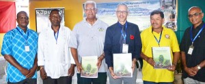 Minister of Agriculture Noel Holder, with Minister of Business Dominic Gaskin and Minister of Indigenous Peoples’ Affairs Sydney Allicock with other officials.