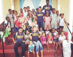 Representatives of ICO with children from Tiger Bay community.