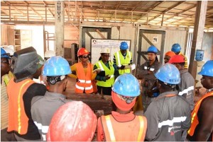 Minister Simona Broomes and other Ministry officials engage some of RUSAL workers.