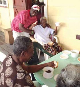 Vice President Andrew Braithwaite and a resident of the home