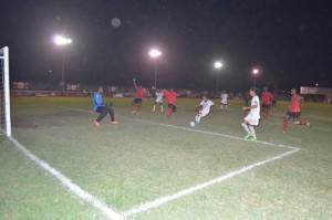 Part of the action in the game between Santos (white uniforms) and Rhythm Squad.