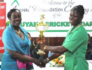Female Cricketer of the year Tremayne Smartt collects her Award from fellow Berbician Minister Nicolette Henry.
