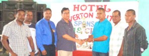 Flashback to the presentation of the sponsorship cheque and trophies by Dr. Pooran Seepersaud, proprietor of Hotel Riverton Suites to UCCA President Mr. Dennis De Andrade. Also in photo are other executives of the UCCA.