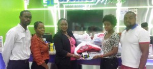 Marketing Assistant at Giftland Mall, Candacy Baveghems (second, right) hands over the school packages to GTU General Secretary, Coretta McDonald yesterday in the presence of the Ministry of Education’s Principal Assistant Secretary  (Finance), Glendon Fogenay; his Deputy, Allison Odell and Marketing and PR Officer, Edison Jefford.