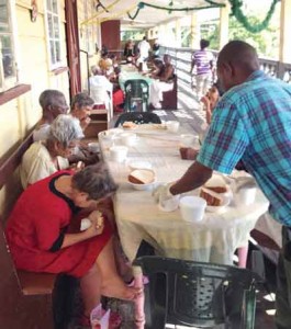 Residents receiving their delicious pepper pot