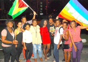 Members and Volunteers of SASOD at their AIDS Candlelight Memorial. Holding the Guyana flag is John Quelch, SASOD Projects Coordinator