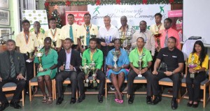 The Awardees with Minister Nicolette Henry (middle sitting) and WICB Director Anand Sanasie (left sitting).