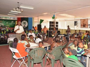 President David Granger as he engaged the children during the Christmas Party, at Congress Place Sophia, earlier today.