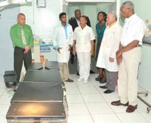 Dr. Michael Pereira, GMO, Medical Superintendent, Obstetrics/Gynaecologist (second from left) takes President David Granger and his team on a guided tour of the main operating theatre at Diamond Diagnostic Centre, during the visit.