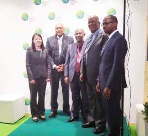 Minister Trotman (second from left) with the team from Global Green Initiative after the signing.