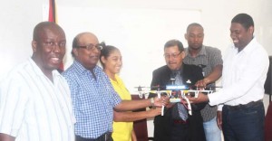 From Left: Permanent Secretary of the Ministry of Agriculture, George Jervis; Chief Executive Officer (CEO) of the National Agricultural Research and Extension Institute (NAREI), Dr. Oudho Homenauth; Representative of the Ministry and Trainer, Zola Narine; Minister Sydney Allicock; Chief Hydromet Officer, Garvin Cummings and Assistant Professor of UT Dallas, Anthony Cummings.